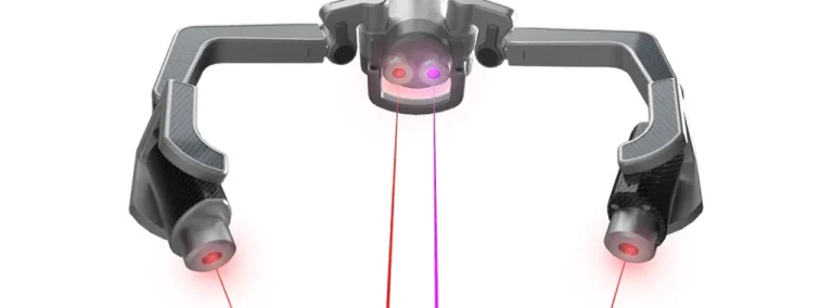 Erchonia's laser therapy device emitting dual beams of red and violet light for precise treatments